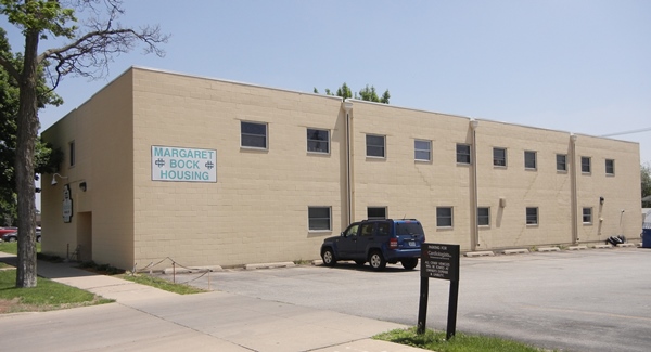 [Photo] Margaret Bock Housing, view from street: Light block building east of parking lot